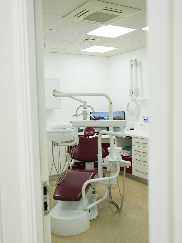 A dental surgery with treatment chair and monitor at Luna Dental